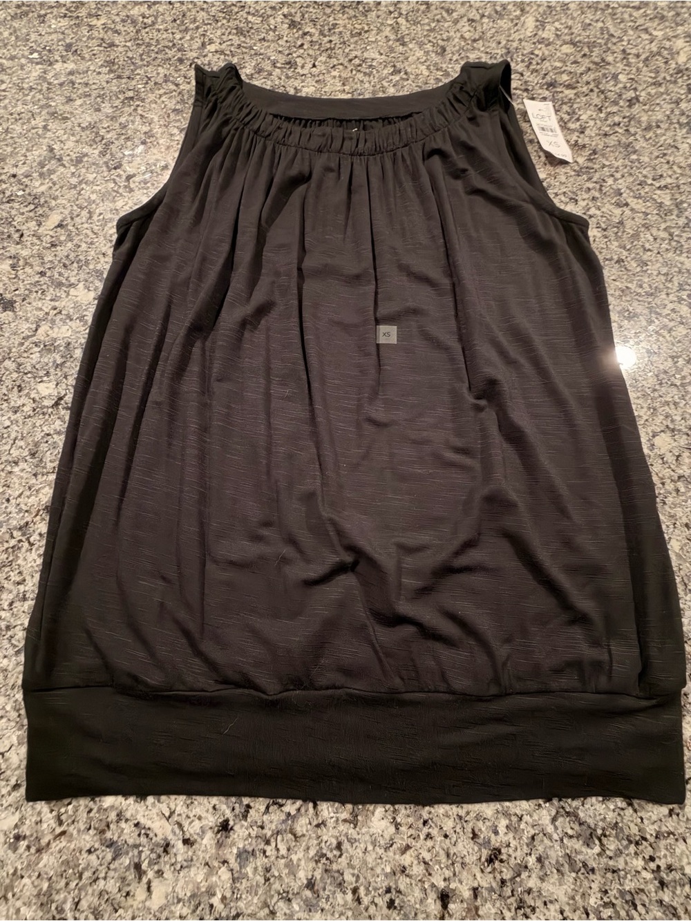 LOFT black tank top with subtle horizontal ribbing, size XS,crew neck,waist band